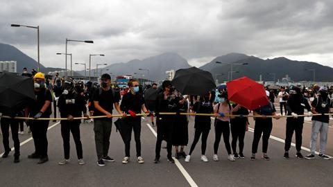 Hong Kong protesters target airport as city mops up