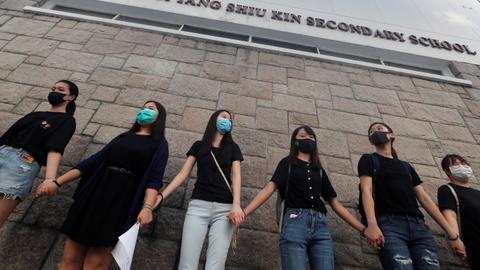 Hong Kong school students form human chain after weekend of protests