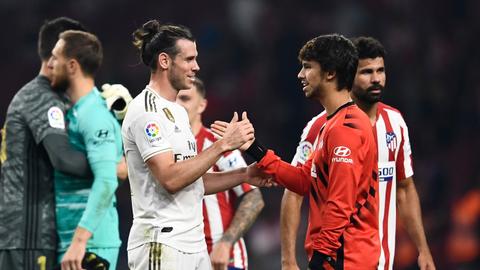 Real hold off Atletico in tight derby to grab top spot in Spain