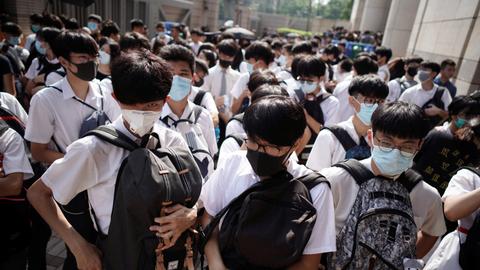 Hong Kong mops up after 180 arrested in violent National Day protests