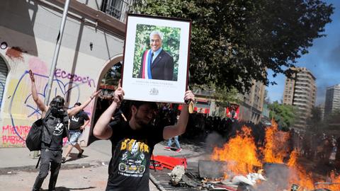 Pinera says demands of Chileans 'loud and clear,' protests begin anew