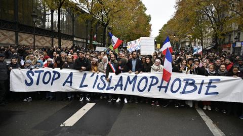 Thousands march in Paris against Islamophobia after mosque attack