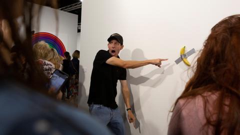 Man eats $120,000 piece of art - a banana taped to wall