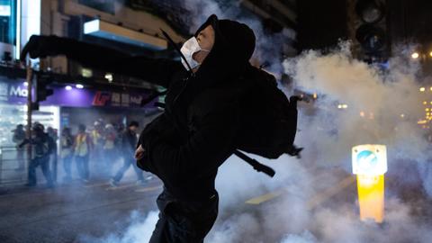 Police, protesters clash as Hong Kong celebrates Christmas