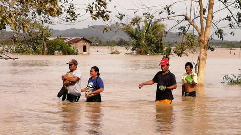 Typhoon kills at least 13 in Philippines