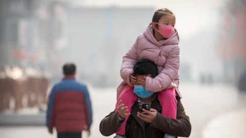 China curbs travel abroad as virus toll tops 100