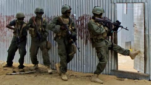 Militants kill at least 3 in day-long gun battle in Kenyan border town