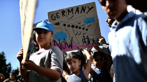 Syrians stuck in Greece protest outside German embassy