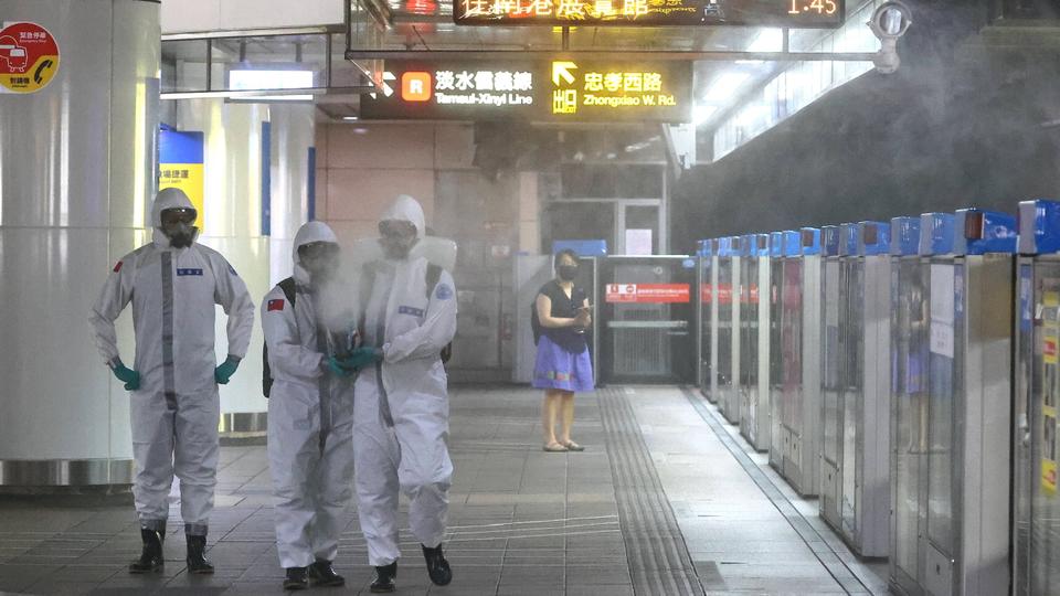 Soldiers disinfect Taipei main station following a surge of coronavirus disease infections in Taiwan on May 18, 2021.