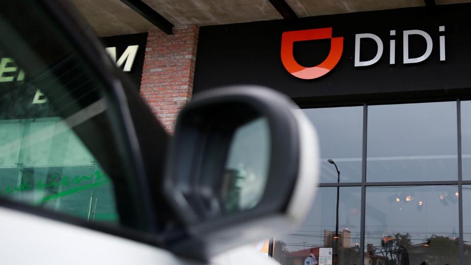 The logo of Chinese ride-hailing firm Didi Chuxing is seen at their new drivers center in Toluca, Mexico, April 23, 2018