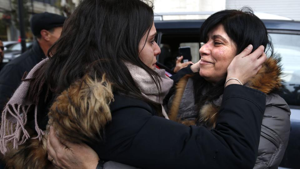 Palestinian activist Khalida Jarrar (R) hugs her daughter Suha (L) in the occupied West Bank city of Ramallah on February 28, 2019.