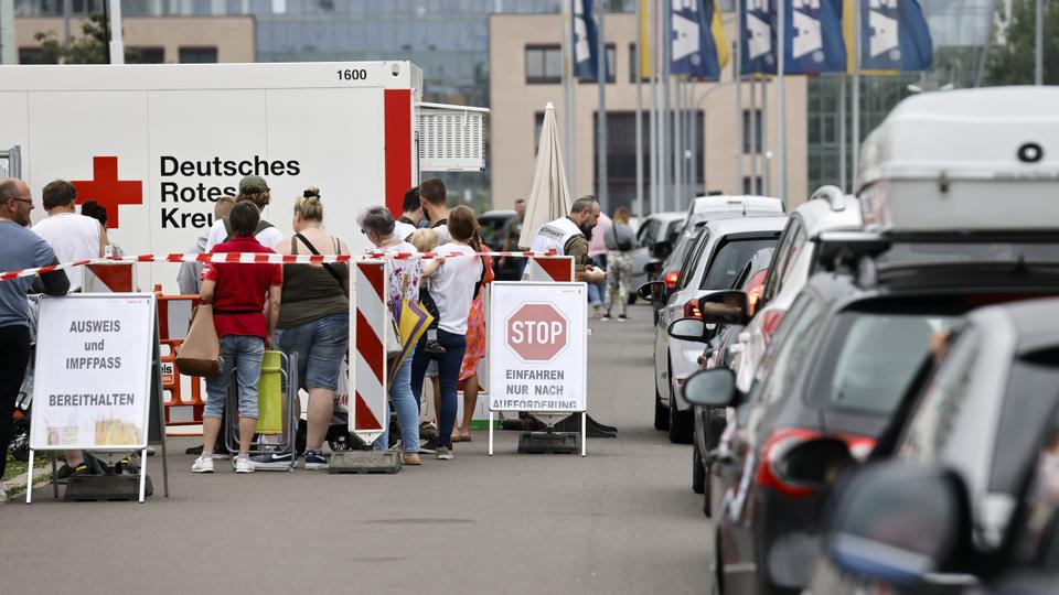 People queue in their cars at a a drive-in vaccination centre against the coronavirus disease in Berlin, Germany, July 17, 2021.