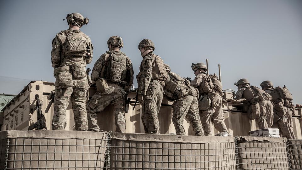 US service members assist with security at an Evacuation Control Check Point (ECC) during an evacuation at Hamid Karzai International Airport, Kabul, Afghanistan, on August 26, 2021.
