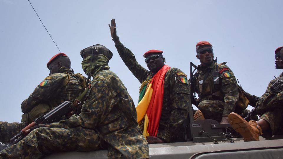 Lieutenant Colonel Mamady Doumbouya, head of the Army’s special forces and coup leader, waves to the crowd as he arrives at the Palace of the People in Conakry on September 6, 2021.