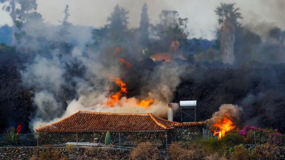 A house burns due to lava from the eruption of a volcano in the Cumbre Vieja national park on the Canary Island of La Palma, September 20, 2021.
