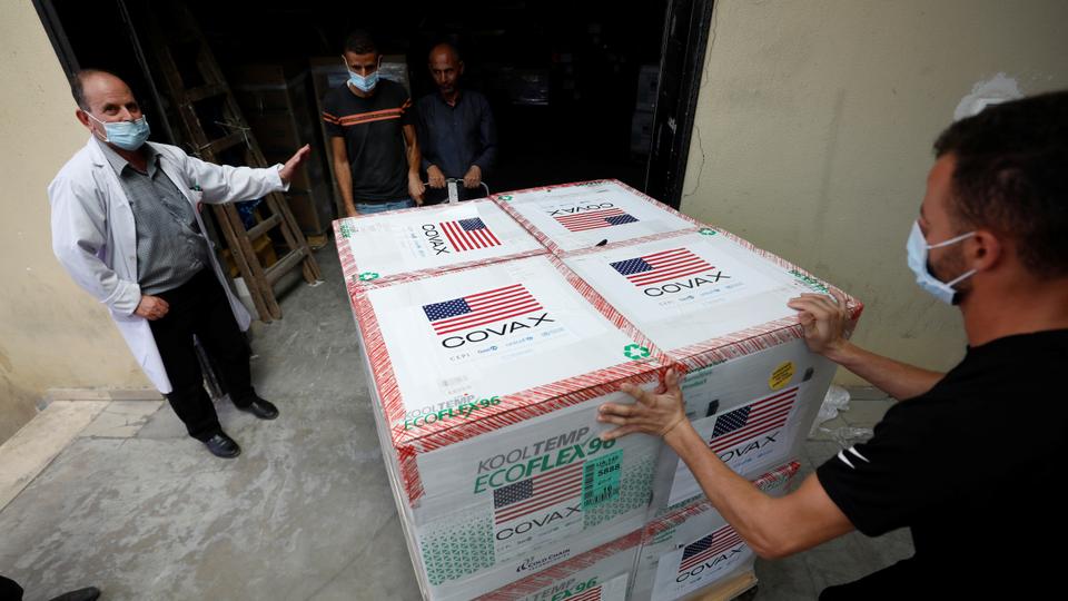 Palestinians in the village of Salem receive a shipment of Moderna vaccines donated by the US in the occupied West Bank on Auguat 24, 2021.