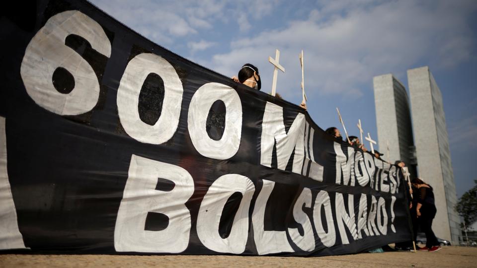 Demonstrators pay tribute to Brazil's 600,000 Covid deaths and protest against President Jair Bolsonaro's handling of pandemic, in Brasilia on October 8, 2021.