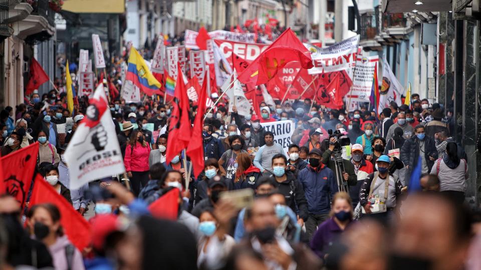 Ecuadorans march against economic measures imposed by the government, including fuel price hikes, amid a state of emergency, in Quito, on October 26, 2021.