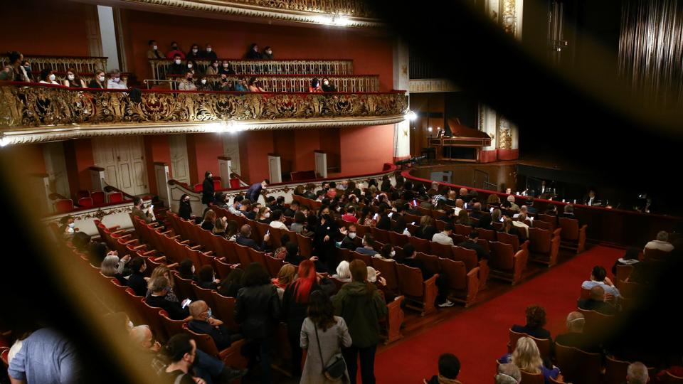 People walk in the Municipal Theater at the opening of the opera 