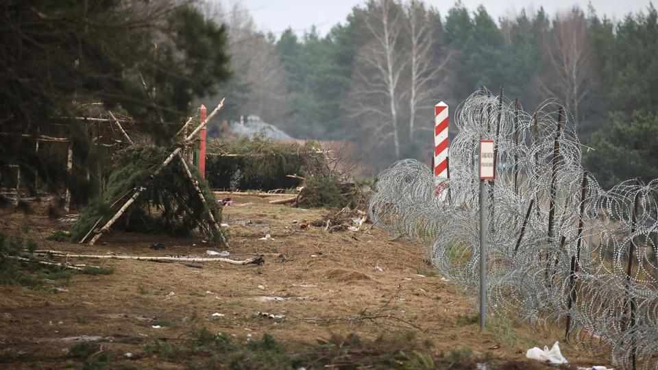 Around ten people are believed to have died in the freezing woods at the Belarus-Poland border.
