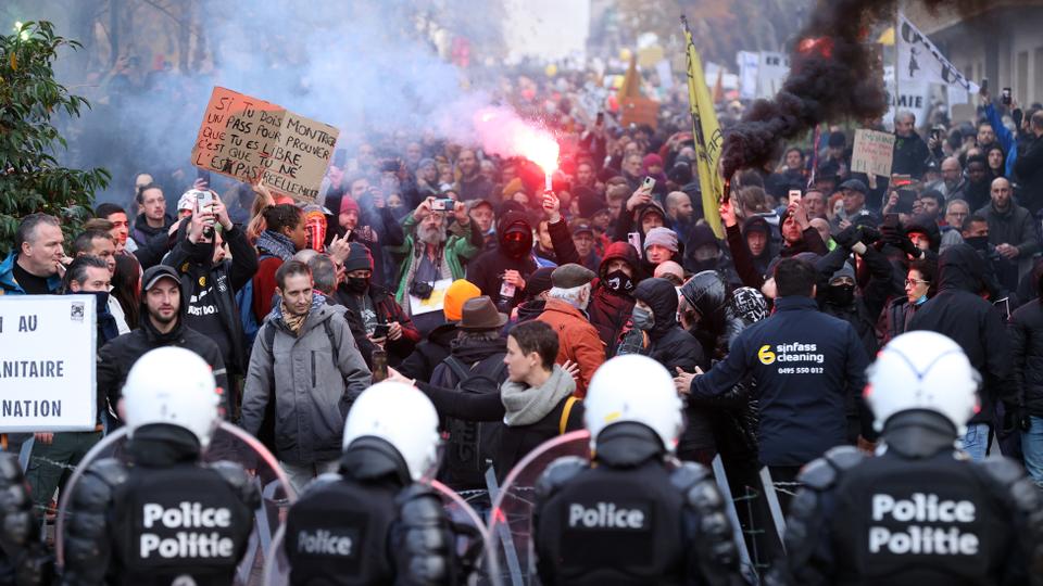 Protesters in Brussels set fire to wood pallets, and social media images showed them attacking police vans with street signs.