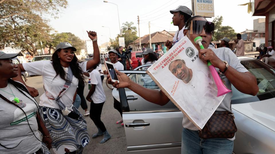 Supporters of Adama Barrow celebrate in capital Banjul ahead of his victory in presidential race.