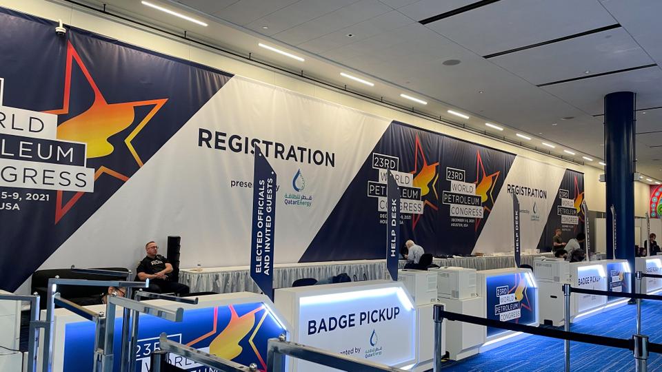 A view of a quiet registration desk for the World Petroleum Congress in Houston, Texas, US on December 5, 2021.