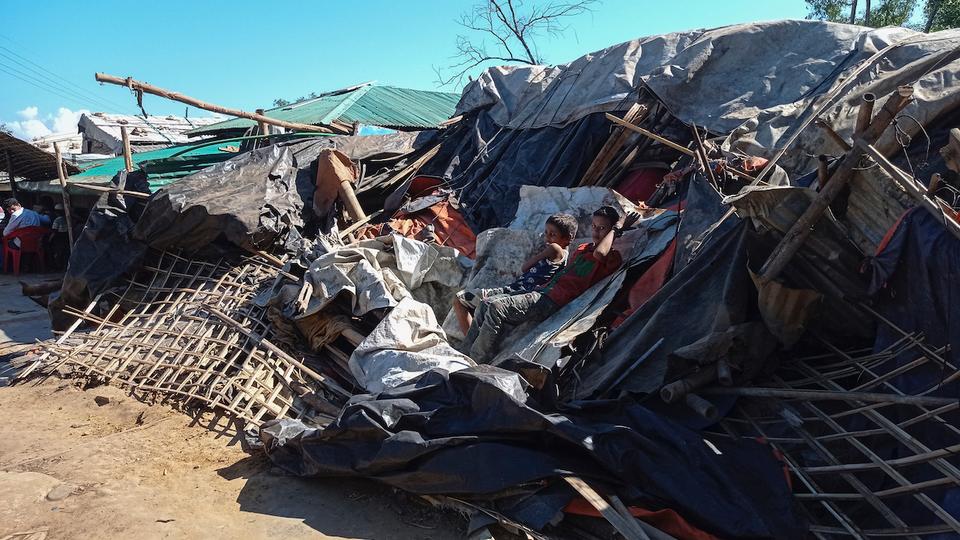 Hundreds of Rohingya gathered at the eviction sites as excavators tore through the bamboo and steel structures.