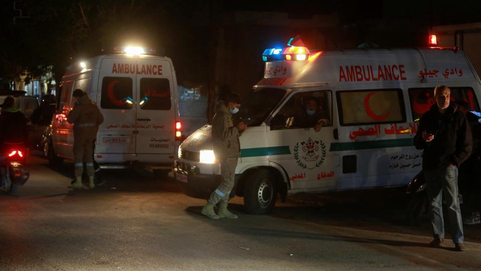 Ambulances are parked at the entrance of the Palestinian camp where an explosion took place, in the southern Lebanese port city of Tyre, Lebanon December 10, 2021.