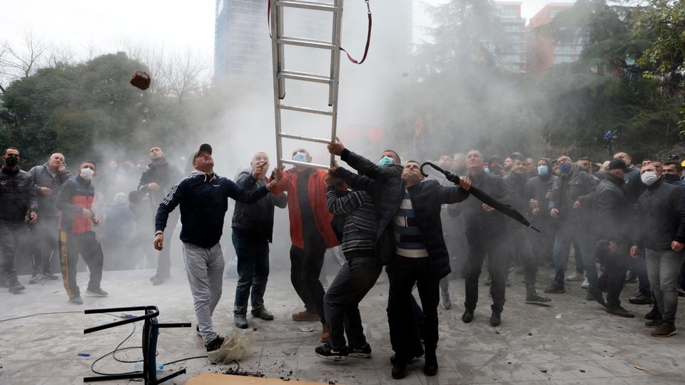 Albanian opposition supporters have clashed with each other and tried to storm their party headquarters following an internal fight for the party leadership.