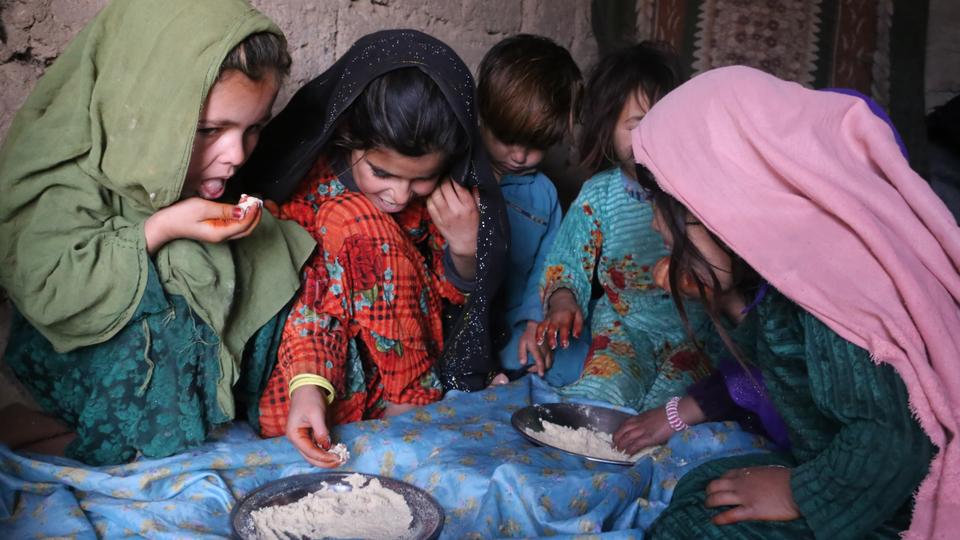 An Afghan family was forced to have their children eat dry flour for days amid increasing poverty rate.