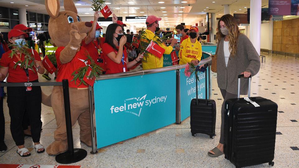 Passengers arrive at International Sydney Airport after Australia has fully reopened its borders.