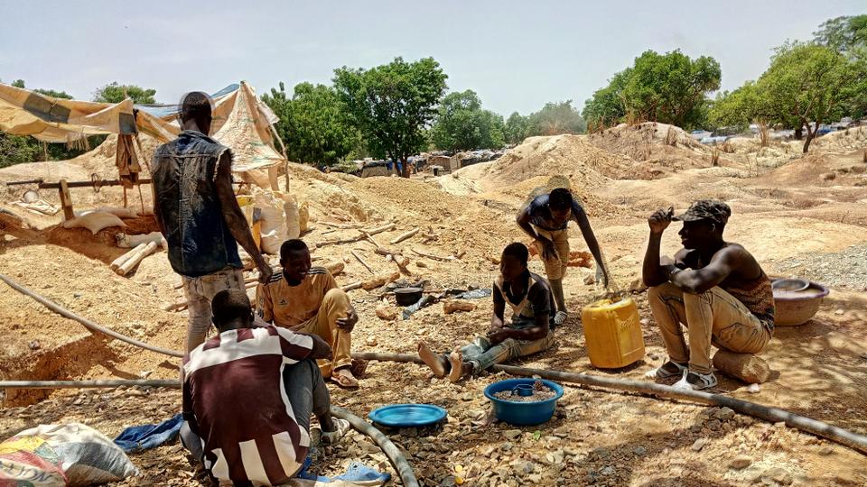 Informal gold miners are seen taking a break from work under the midday sun at an artisanal mining site near Dano, southern Burkina Faso on May 5, 2020.