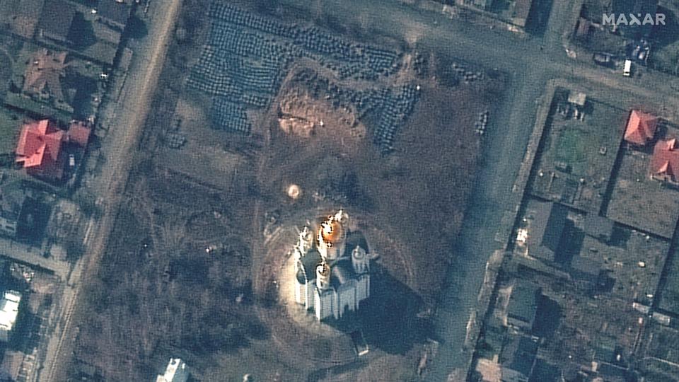 A satellite image shows the grave site near the Church of St. Andrew and Pyervozvannoho All Saints, in Bucha.