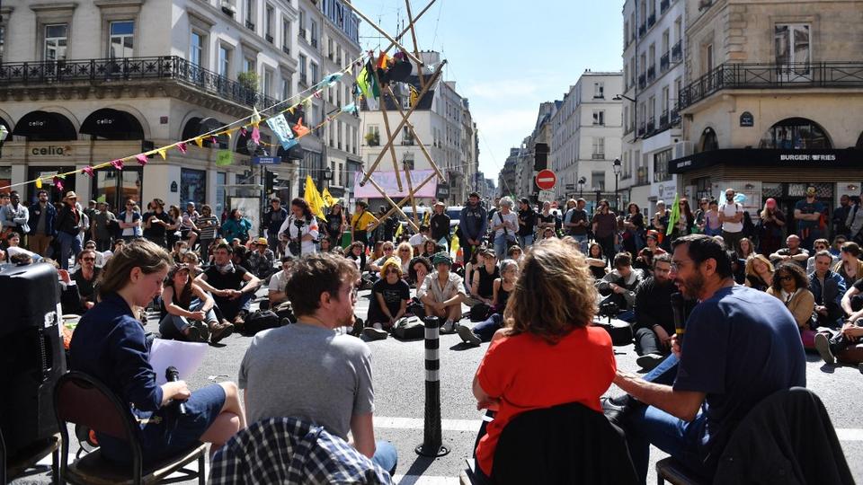 Activits of the climate change action group Extinction Rebellion block the Paris Grand Boulevard during a demonstration in Paris, on April 16 2022.