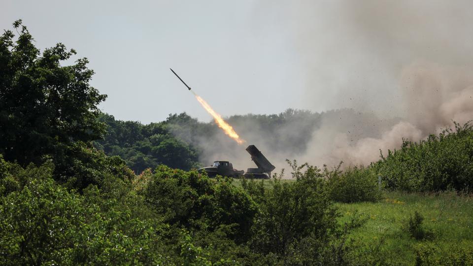 Ukrainian service members fire a BM-21 Grad multiple rocket launch system, near the town of Lysychansk, Luhansk region.