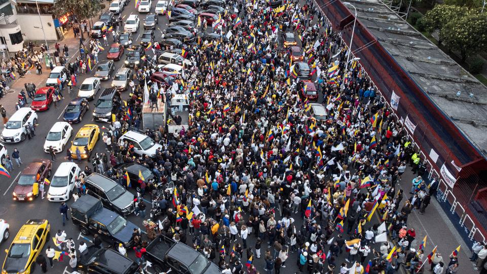 Aerial view of Ecuadorian government supporters holding a demonstration demanding for peace in northern Quito on June 25, 2022, while a parliamentary session called by opposition lawmakers for a no confidence vote against President Guillermo Lasso is being held at the National Assembly, in the framework of Indigenous-led protests against the government.