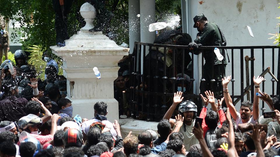 The declaration of both a nationwide state of emergency and a curfew failed to disperse protesters, who poured into PM Ranil Wickremesinghe's office.