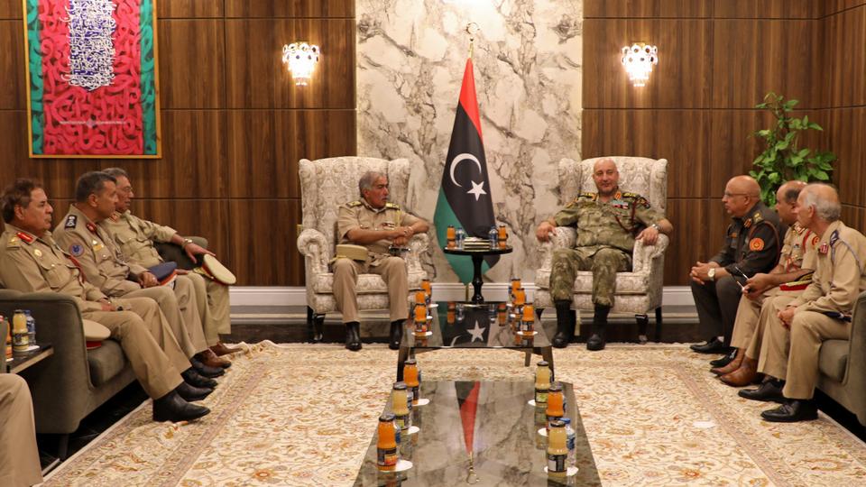 UN's top Libya envoy says he is heartened by the outcome of the meeting between General Haddad (C-R) and General Nadhouri (C-L) of rival sides.