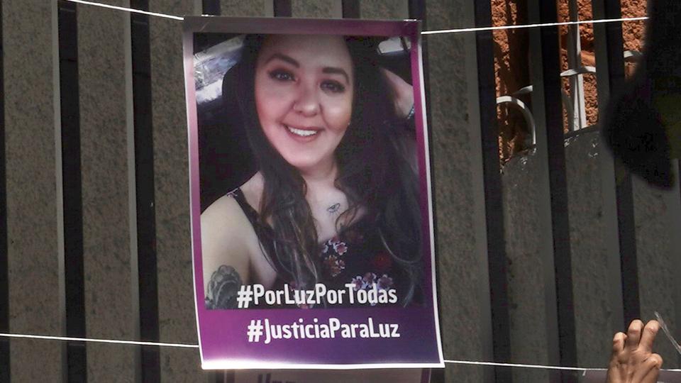 Friends and family, carrying flowers and purple balloons, accompanied Luz Raquel Padilla's coffin during a wake at which the priest appealed for an end to violence against women.