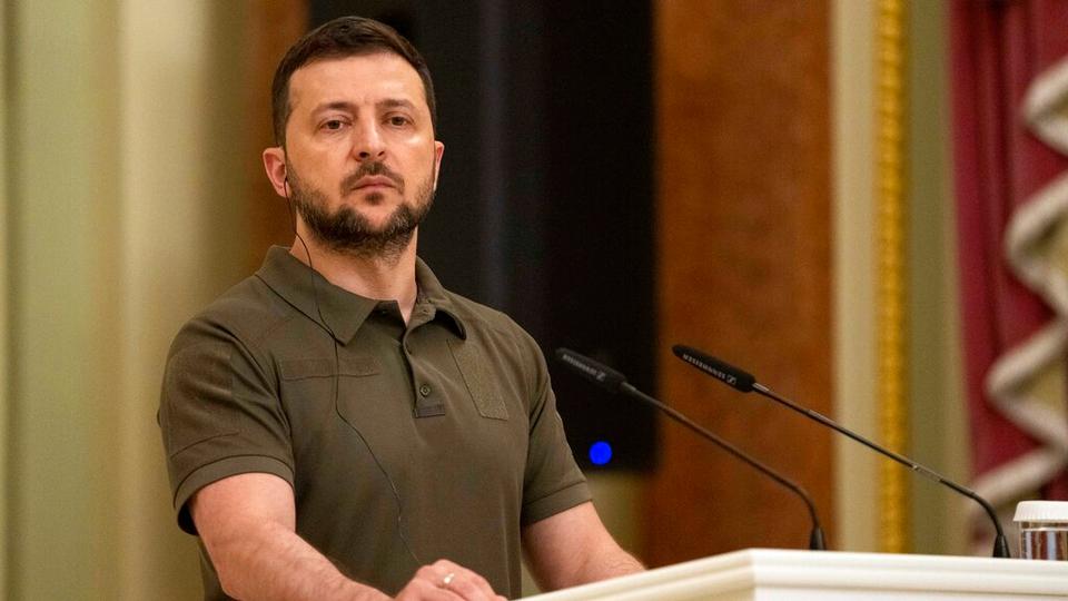 Ukrainian President Volodymyr Zelenskyy stands at the podium during a joint news conference with Australian Prime Minister Anthony Albanese, in Kyiv, Ukraine, July 3, 2022.