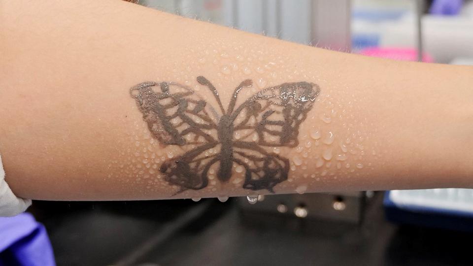 Water sprays on arm are seen with an electronic tattoo (e-tattoo) for the wettability test at the Korea Advanced Institute of Science and Technology (KAIST) in Daejeon, South Korea, July 26, 2022.