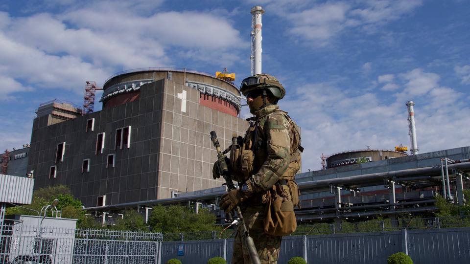 In this file photo taken on May 1, 2022, A Russian serviceman patrols the territory of the Zaporizhzhia Nuclear Power Station in Energodar.