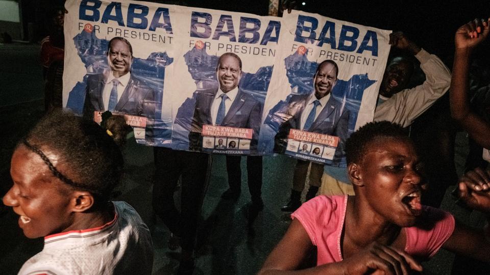 Supporters of Raila Odinga, celebrate in the street ahead of contested presidential election results in Kisumu port city.