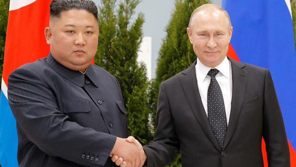 Russian President Vladimir Putin and North Korea's leader Kim Jong Un shake hands during their meeting in Vladivostok, Russia, April 25, 2019.