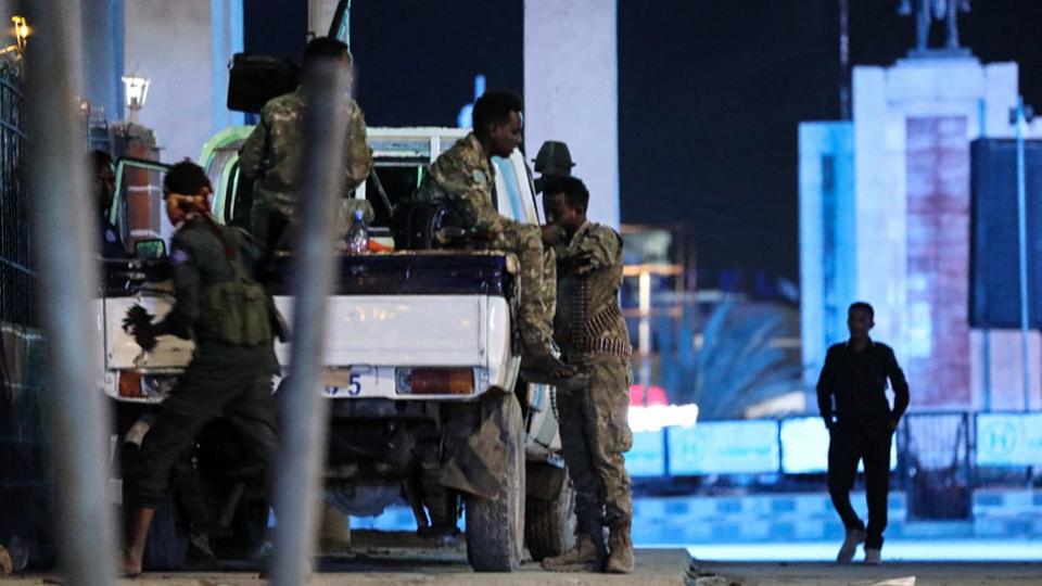 Security forces patrol near the Hayat Hotel after an attack by Al Shabab in Somalia's Mogadishu.