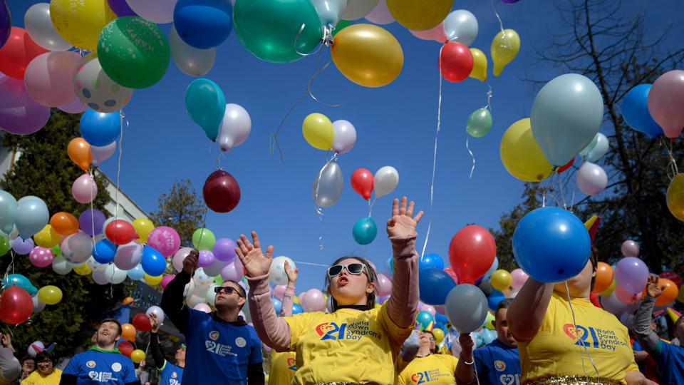 Young people with Down Syndrome release colourful balloons during celebrations marking World Down Syndrome Day in Bucharest, Romania.