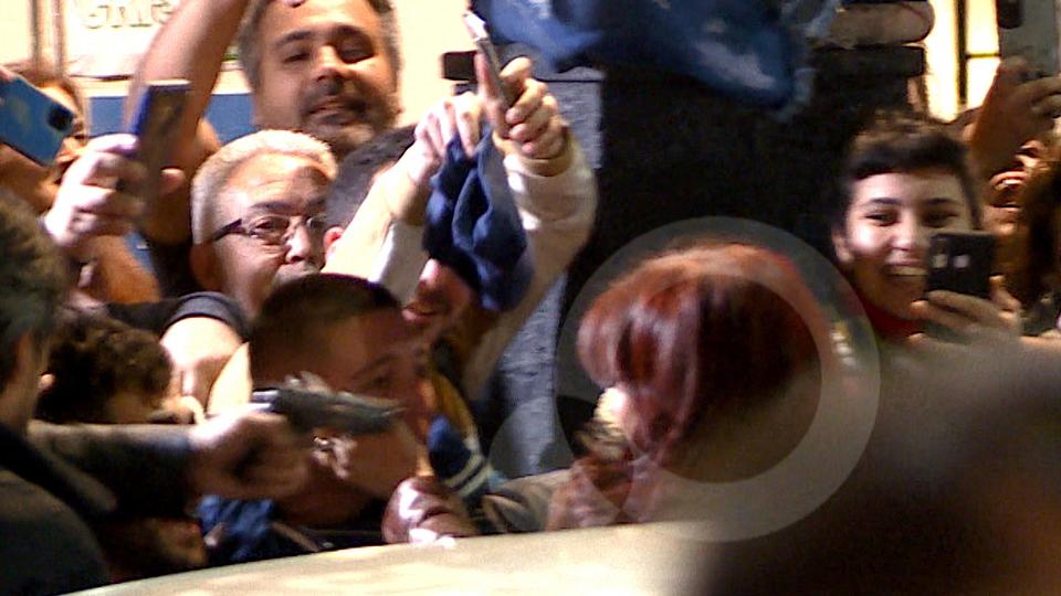 Image released by TV Publica shows a man pointing a gun at Argentine Vice President Cristina Fernandez de Kirchner as she arrives at her residence in Buenos Aires.