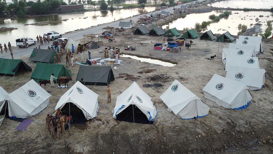 Pakistan army helps flood-affected people at a makeshift camp after heavy monsoon rains at Sohbatpur in Jaffarabad district of Balochistan province.