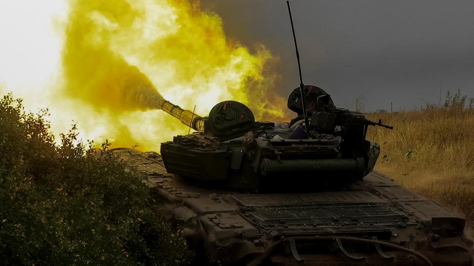 Ukrainian servicemen fire toward Russian troops with a tank at a position in Donetsk region, as Russia's attack on Ukraine continues.